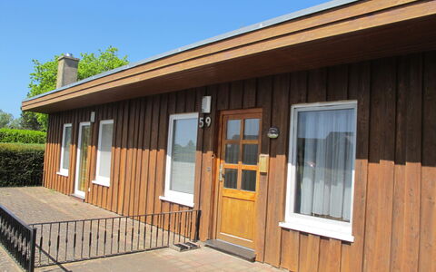 Villa Meike (Insel Poel): Property, Sky, Window, Wood, Shade, Cottage, Tree, Door, Siding, Wood Stain