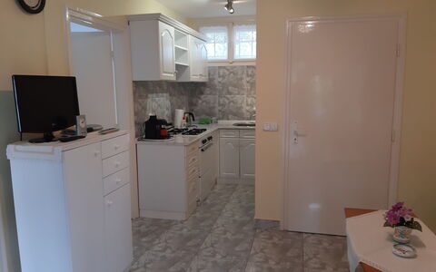 Szabo: Cabinetry, Building, Wood, Interior Design, Countertop, Clock, Home Appliance, Floor, Flooring