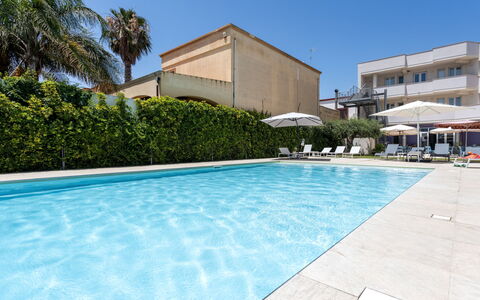 Marsala 120: Water, Plant, Property, Sky, Building, Swimming Pool, Azure, Shade, Tree, Outdoor Furniture