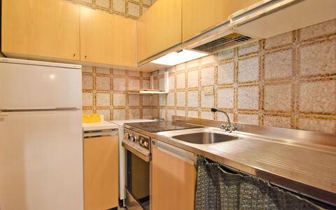 Madonna di Campiglio 300: Property, Room, Countertop, Cabinetry, Kitchen, Interior Design, Building, Furniture, Yellow, Tile