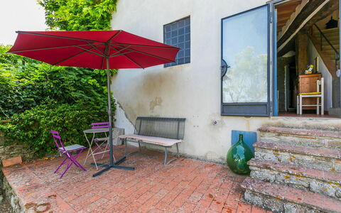 Ridaldi: Plant, Furniture, Building, Umbrella, Shade, Outdoor Furniture, Window, Interior Design, Table, Leisure