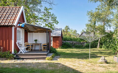 Bergkvara: Plant, Sky, Building, Tree, Door, Land Lot, Shade, House, Grass, Natural Landscape