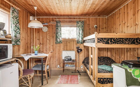 Boda Åsen Jaktstugan: Building, Property, Furniture, Table, Wood, Interior Design, Window, Couch, Plant, Floor