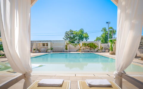 Villa Niraclo': Water, Building, Sky, Property, Plant, Swimming Pool, Azure, Window, Shade, Interior Design
