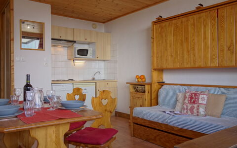 Tignes 395: Furniture, Property, Table, Cabinetry, Picture Frame, Wood, Azure, Interior Design, Flooring, Comfort