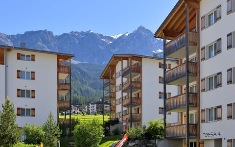 Savognin 50: Sky, Building, Plant, Mountain, Daytime, Property, Window, Azure, Cloud, Tree