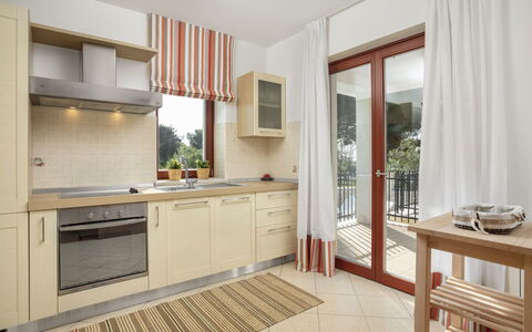 Villa Beach Front: Furniture, Property, Room, Cabinetry, Interior Design, Building, Countertop, Kitchen, Floor, Real Estate