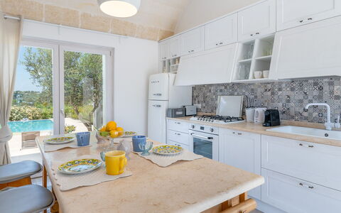 Villa Amelia Ostuni: Furniture, Interior Design, Flooring, Countertop, Kitchen, Floor, Home, Chair, Room, Cabinetry