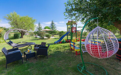 Bozac: Plant, Sky, Green, Natural Environment, Tree, Architecture, Shade, Leisure, Public Space, Outdoor Furniture
