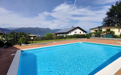 Torre del Lago: Water, Cloud, Sky, Plant, Swimming Pool, Building, Azure, Rectangle, Shade, Grass