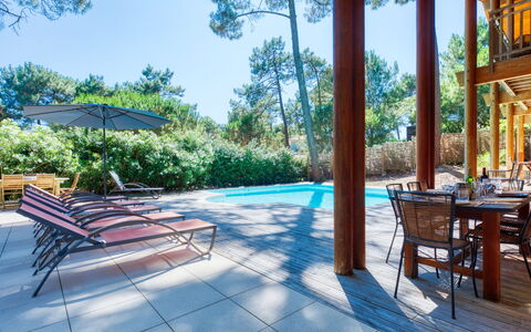 Villa la Lisière des Pins: Plant, Furniture, Property, Sky, Table, Shade, Swimming Pool, Tree, Outdoor Furniture, Architecture