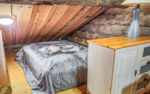 Kulta-Vuosseli a: Wood, Furniture, Bedroom, Flooring, Floor, Interior Design, Room, Attic, Lighting, Bed