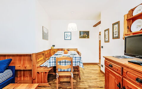 Condominio Val di Fassa: Furniture, Table, Cabinetry, Drawer, Building, Wood, Interior Design, Orange, Picture Frame, House