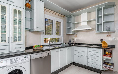 Villa Juna: Furniture, Property, Table, Cabinetry, Chair, Wood, Building, Lighting, Countertop, Interior Design