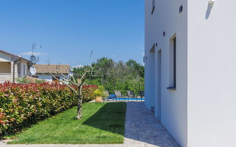 Villa Isabela: Plant, Sky, Building, Window, Land Lot, Flower, Urban Design, Road Surface, Grass, Facade