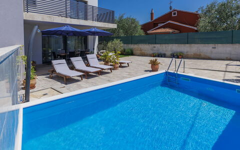 Villa Leonardo: Water, Property, Swimming Pool, Sky, Plant, Azure, Blue, Shade, Outdoor Furniture, Body Of Water