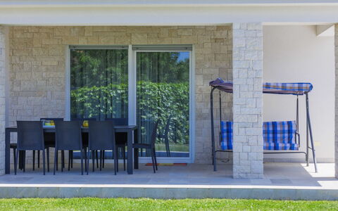 Villa Zirdum: Property, Plant, Shade, Door, Wood, Chair, Grass, Facade, Tree, Real Estate