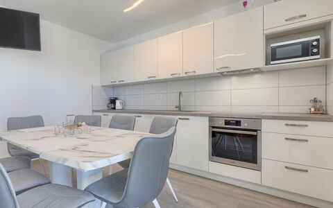 Villa Zirdum: Furniture, Cabinetry, Property, Countertop, Table, Chair, Building, Kitchen, Kitchen Stove, Wood