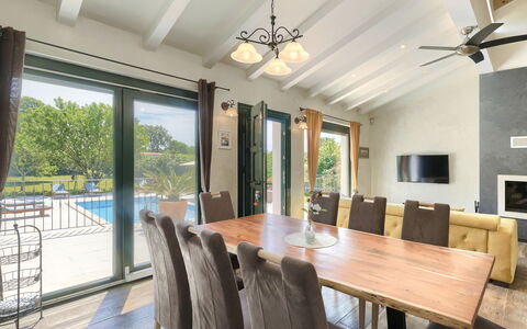 Villa Bernard: Table, Property, Furniture, Wood, Interior Design, Living Room, Chair, Shade, Floor, Flooring