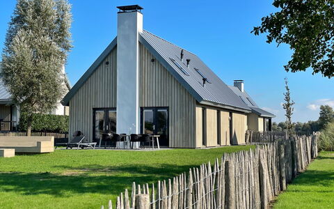 Oesterdam Resort: Furniture, Table, Building, Chair, Tableware, Cloud, Sky, Tablecloth, Outdoor Furniture, Shade