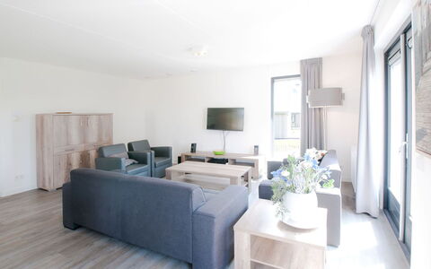 Oesterdam Resort: Furniture, Room, Interior Design, Living Room, Property, White, Building, Floor, Ceiling, House