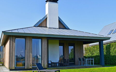 Oesterdam Resort: Furniture, Table, Building, Chair, Tableware, Cloud, Sky, Tablecloth, Outdoor Furniture, Shade
