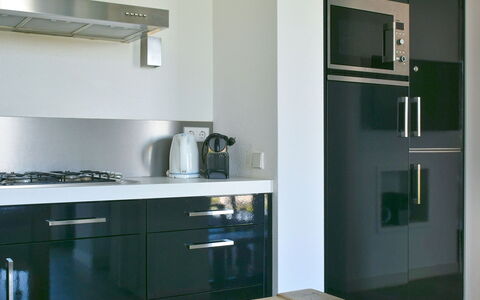 Oesterdam Resort: Room, Furniture, Property, Kitchen, Countertop, Cabinetry, Interior Design, Building, Material Property, Kitchen Stove