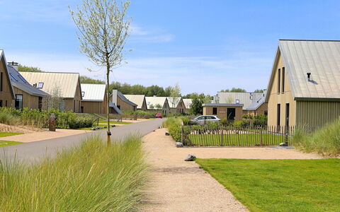 Oesterdam Resort: Sky, Plant, Cloud, Building, Road Surface, Window, Land Lot, Grass, Street Light, Tree