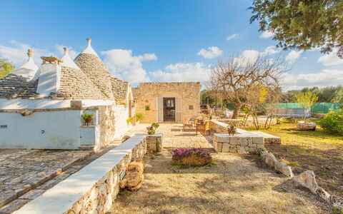 Trullo Con Piscina Per Bambini: Sky, Cloud, Plant, Building, Tree, Cottage, Landscape, Window, Residential Area, Roof