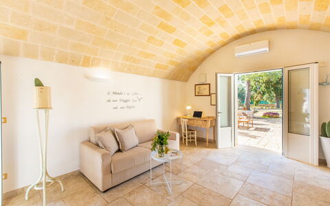 Trullo Con Piscina Per Bambini: Furniture, Property, Plant, Houseplant, Chair, Interior Design, Comfort, Wood, Couch, Table