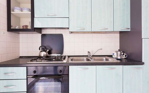 Villa Brigida: Countertop, Kitchen, Cabinetry, Room, Tile, Furniture, Property, Sink, Interior Design, Kitchen Stove