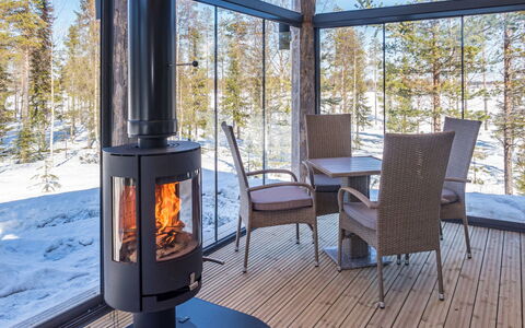 Villa Aurora: Wood Stain, Living Room, Hardwood, Wood-Burning Stove, Wood Flooring, Porch, Light Fixture, Outdoor Structure, Deck