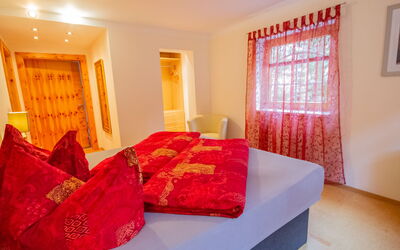 Zillertal Residenz 140.2: Room, Furniture, Bedroom, Property, Red, Interior Design, Bed, Orange, Bed Sheet, Real Estate