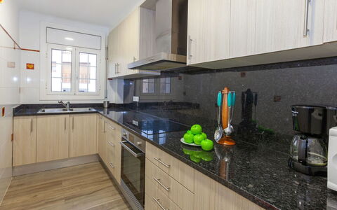 Cap de Tossa: Countertop, Property, Room, Kitchen, Cabinetry, Yellow, Furniture, House, Interior Design, Building