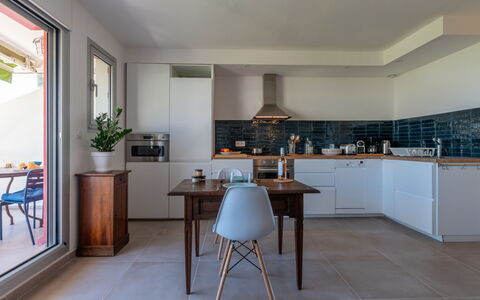 La Grande Motte 130: Furniture, Plant, Table, Building, Cabinetry, Wood, Houseplant, Interior Design, Kitchen, Floor