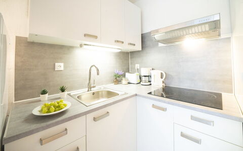 La Grande Motte 310: Countertop, Kitchen, Interior Design, Kitchen Appliance, Major Appliance, Flooring, Cabinetry, Plumbing Fixture, Furniture, Sink