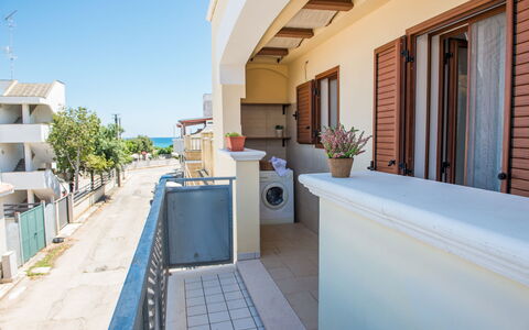 Appartamento Pineta Mare: Daytime, Building, Property, Sky, Azure, Plant, Window, Shade, Architecture, Houseplant
