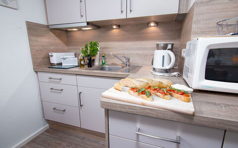 Sanddüne: Cabinetry, Countertop, Property, Furniture, Building, Kitchen, Kitchen Appliance, Wood, Tap, Interior Design