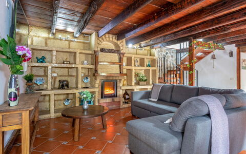 Villa Torrita: Furniture, Table, Couch, Picture Frame, Plant, Wood, Houseplant, Interior Design, Architecture, Living Room