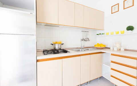 Villa Anna: Yellow, Room, Kitchen, Property, Cabinetry, Furniture, Countertop, Orange, Interior Design, Tile