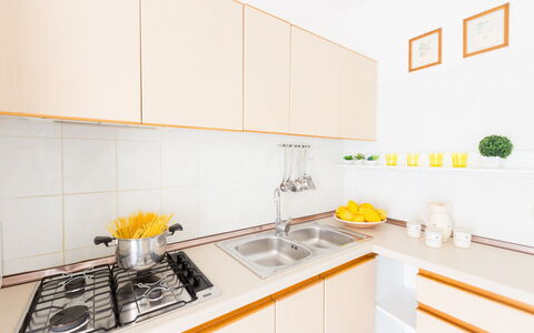 Villa Anna: Yellow, Room, Kitchen, Property, Countertop, Furniture, Interior Design, Tile, Real Estate, Building
