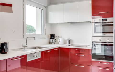 La Closerie des Tremieres: Room, Countertop, Kitchen, Property, Cabinetry, Furniture, Red, Interior Design, Building, Kitchen Stove