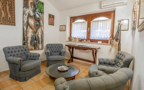 Messi: Furniture, Couch, Picture Frame, Table, Property, Window, Building, Wood, Comfort, Living Room