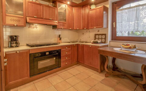Messi: Brown, Cabinetry, Countertop, Furniture, Sink, Window, Tap, Plumbing Fixture, Kitchen, Building