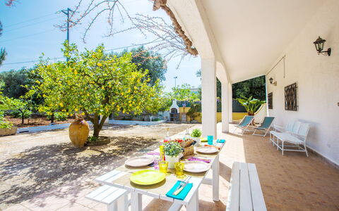 Villa Mediterranea: Property, Yellow, Real Estate, Room, Building, House, Table, Interior Design, Furniture, Vacation