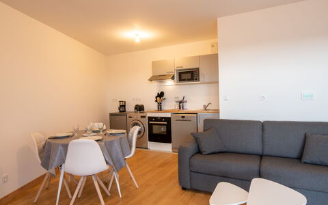 Les Cavaliers: Furniture, Table, Property, Couch, Comfort, Wood, Lighting, Interior Design, Flooring, Picture Frame
