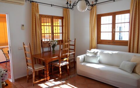 Apartamento Caracola: Furniture, Table, Building, Window, Picture Frame, Wood, Lamp, Comfort, Textile, Shade