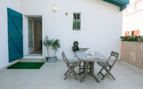Etxe Tikia: Plant, Table, Furniture, Building, Window, Chair, Door, Wood, Interior Design, Flowerpot