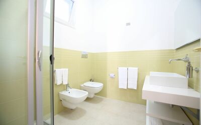 Villa Afrodite: Plumbing Fixture, Bathroom, Purple, Toilet, Building, Interior Design, Toilet Seat, Floor, Bathroom Sink
