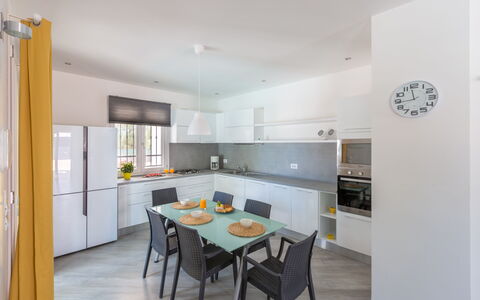 Villa Stella Cadente: Cabinetry, Furniture, Countertop, Table, Window, Building, Kitchen, Wood, Chair, House
